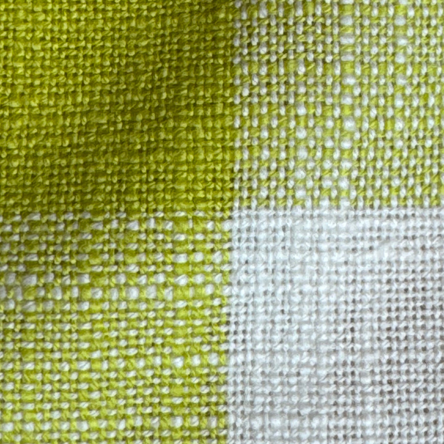 Close-up of citron and cream check cotton fabric weave texture